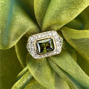 Emerald Green ring surrounded by gold and crystals size 9 like new, never worn